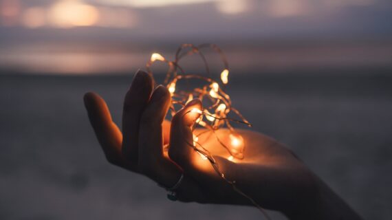 photo of a hand holding lights