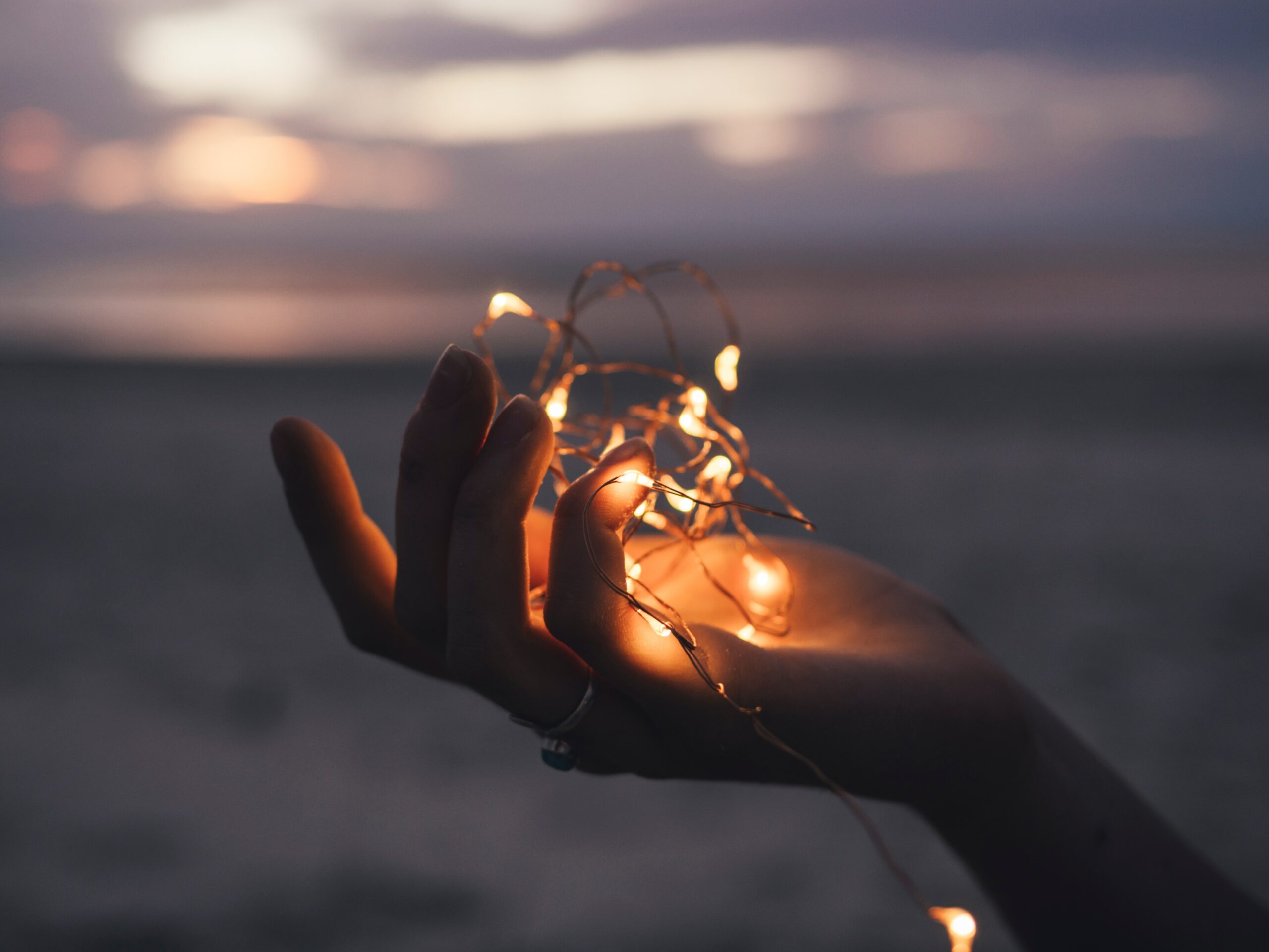 photo of a hand holding lights