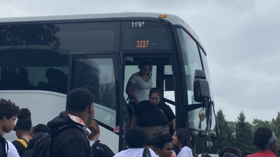 Image of families disembarking from a bus at Dorney Park